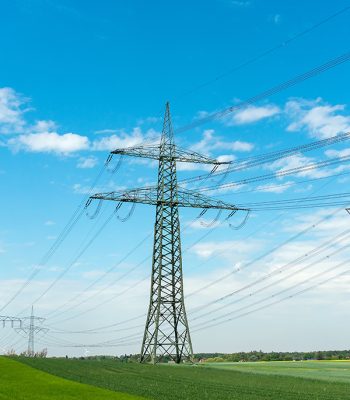 high-voltage-lines-on-a-sunny-day-R2MJQXF